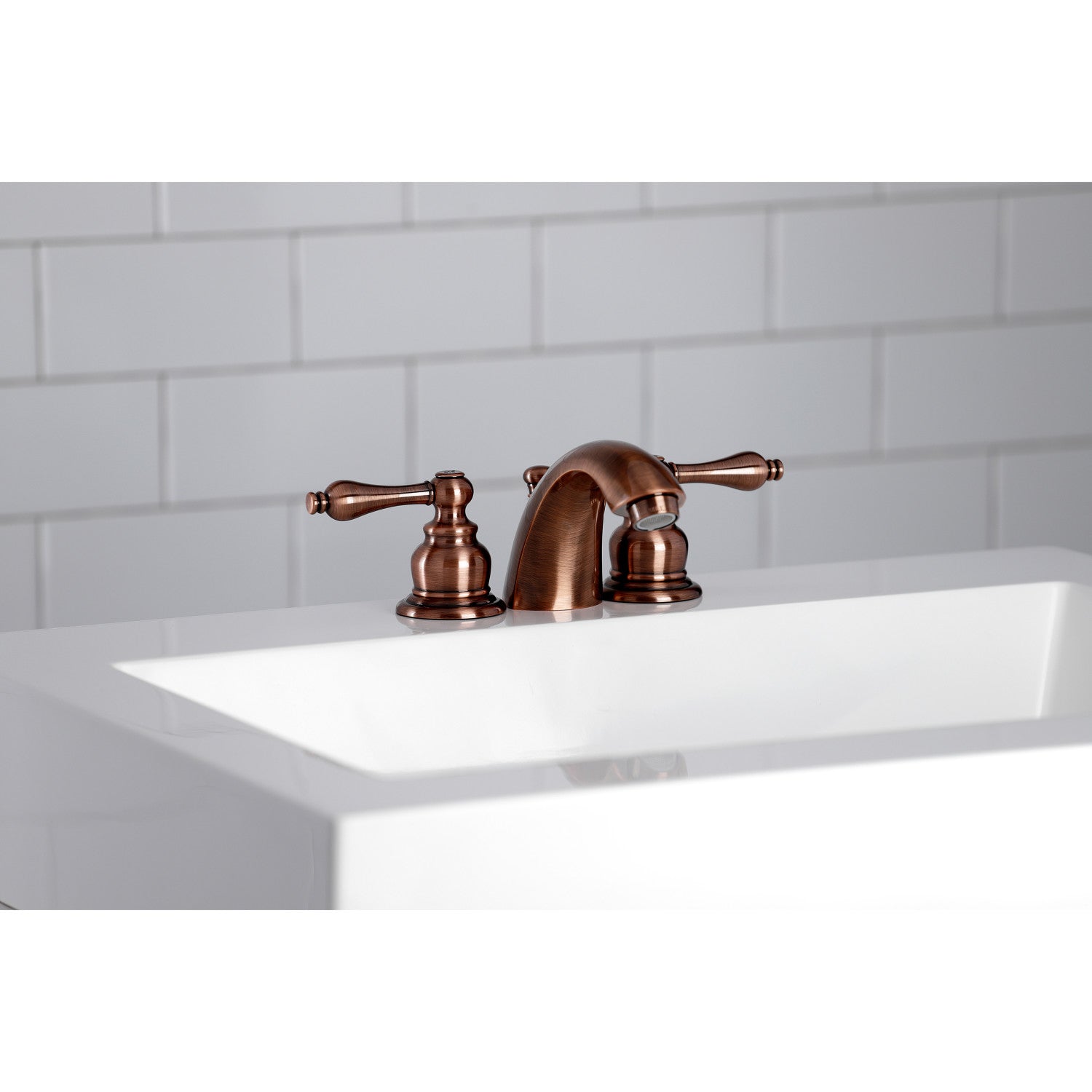 Kingston Heirloom KB946AL - Victorian Two-Handle 3-Hole Deck Mount Mini-Widespread Bathroom Faucet with Pop-Up Drain, Antique Copper — thumbnail 2